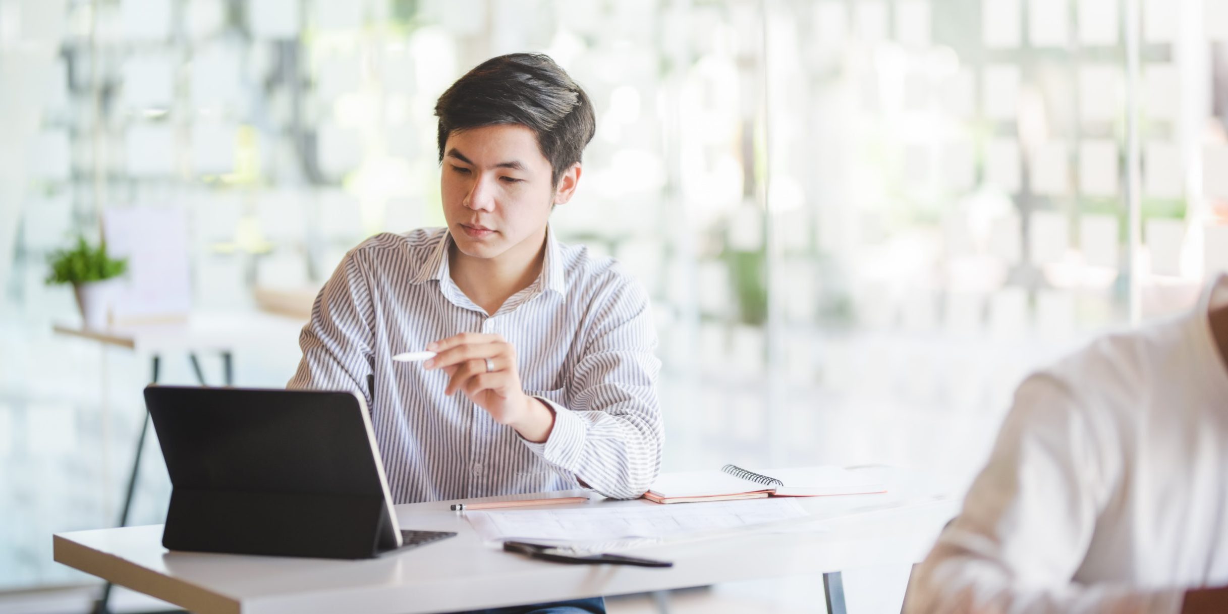 man in office planning a marketing strategy