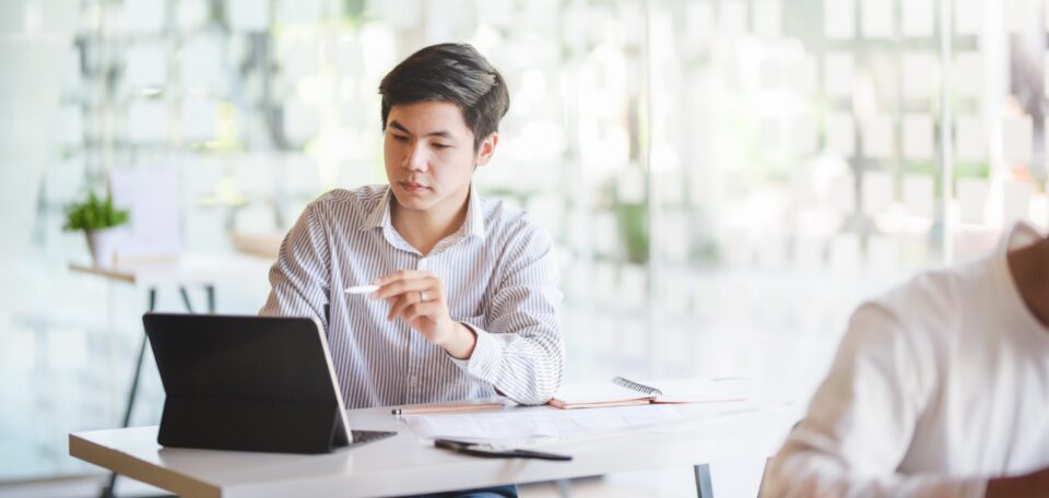 man in office planning a marketing strategy