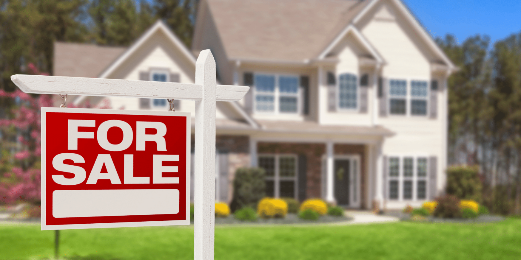 home for sale with sign